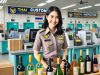 Female customs officer in Thailand in front of wine bottles.